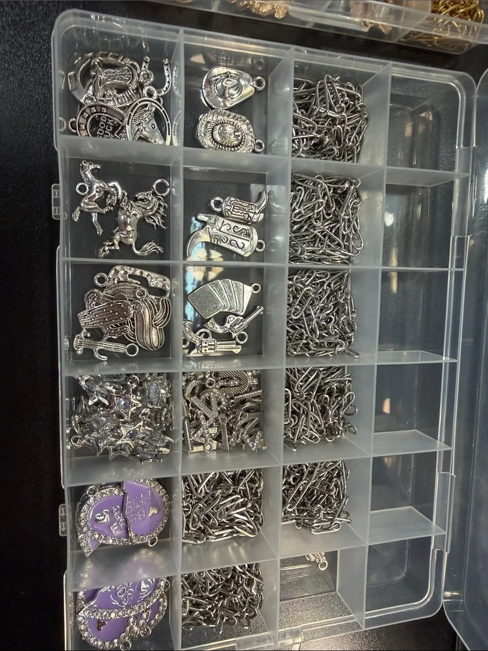 Charm necklace and bracelet making kit. Everything in the picture is included.